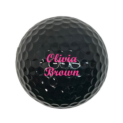 Customized Personalized Black Golf Ball 12 Pack Script MT Bold in Pink