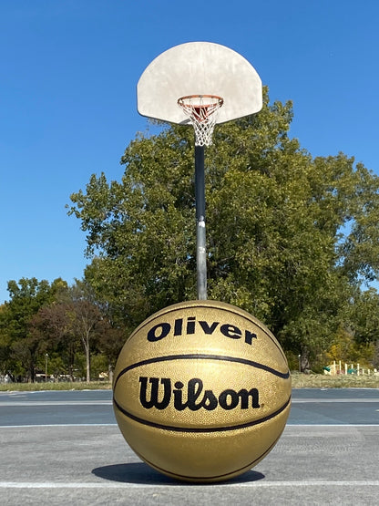 Personalized Wilson Gold Basketball Displayed on Court